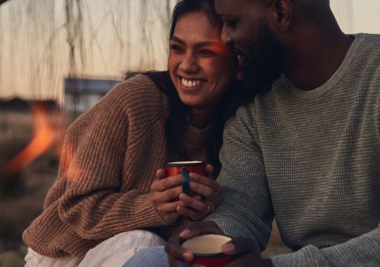 Couple enjoying campfire at Wilga Station, Evans Plains