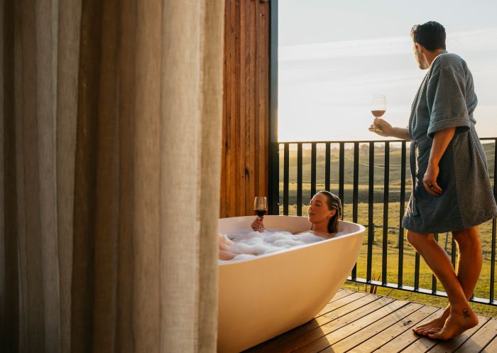 Cupitt's Estate Villas, Ulladulla Couple enjoying bath and wine from balcony at Cupitt's Estate Villas, Ulladulla
